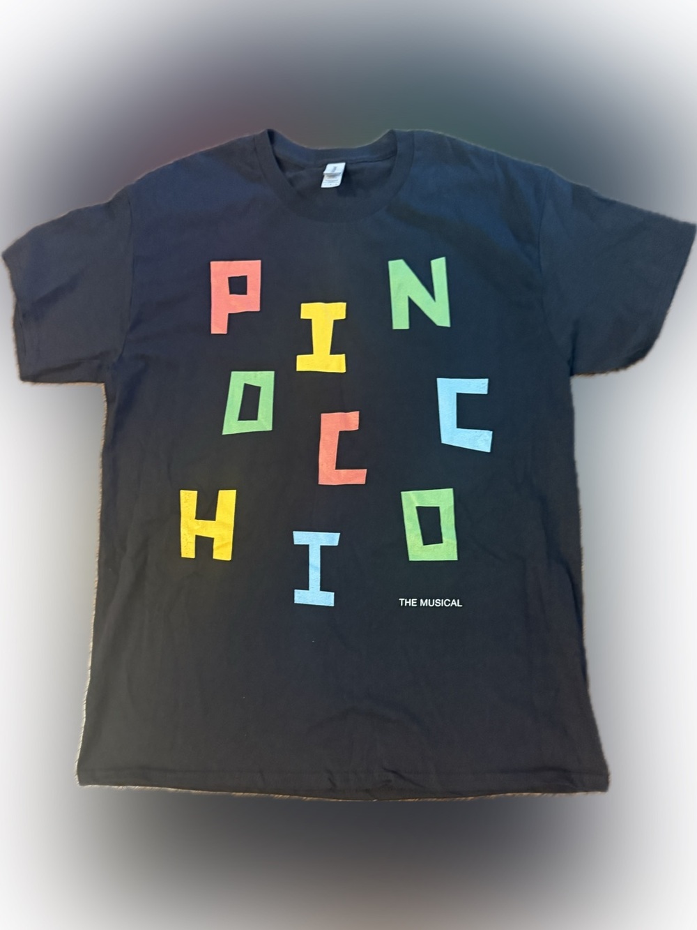 Pinocchio Graphic Black Tee with Multicolor Letters | Sz L